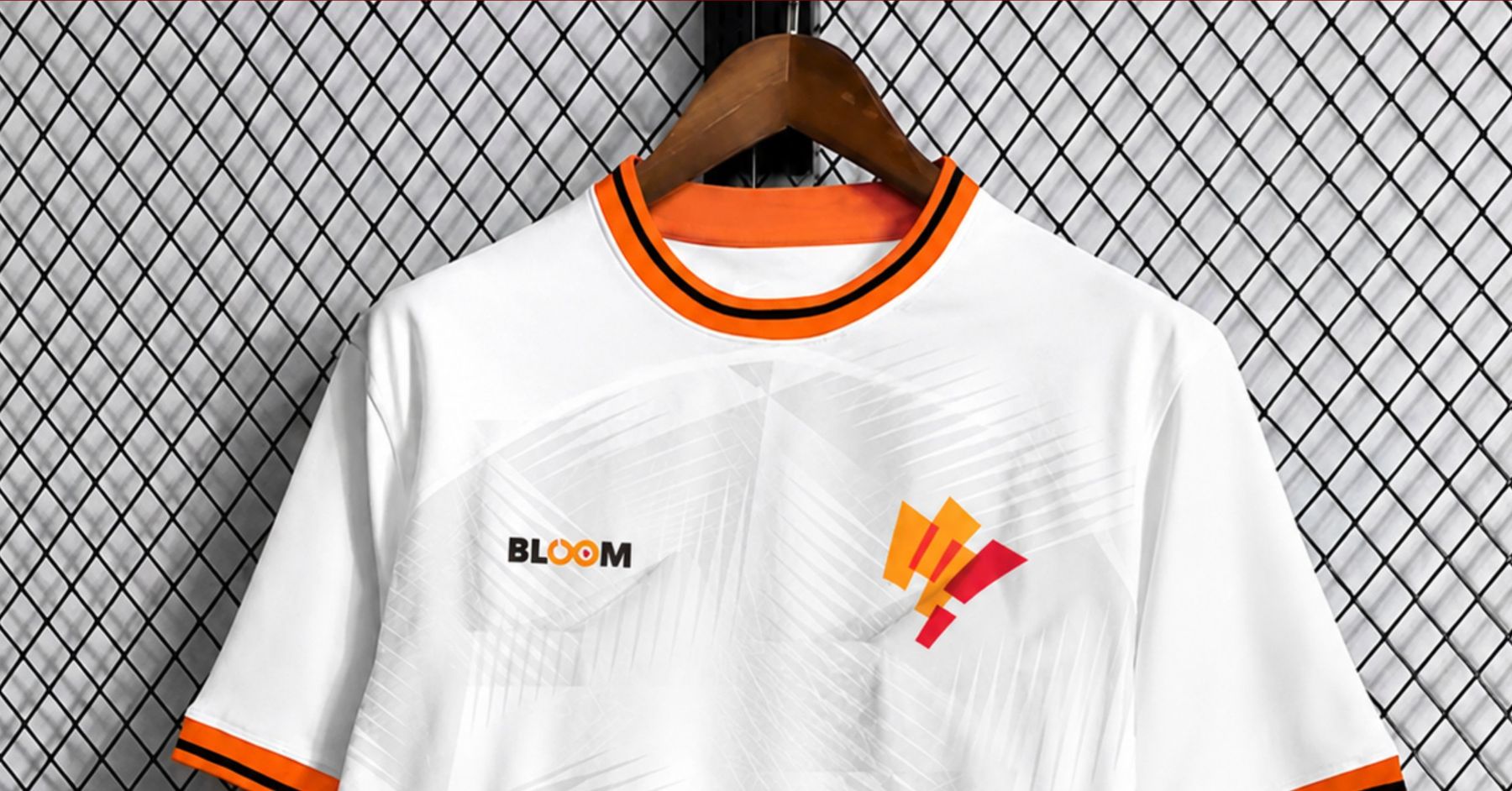 The Bloom Olympics jersey — white with an orange collar, the Bloom Olympics mark on the chest
